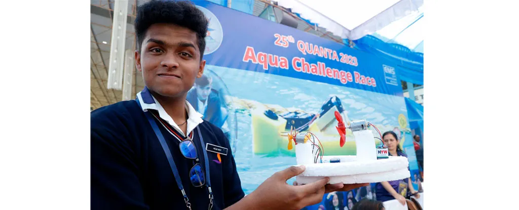 A participant showcasing his self-designed water boat for the Aqua Challenge Race at Quanta