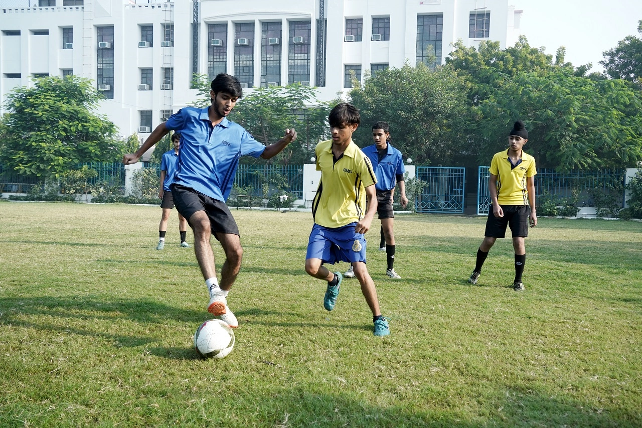 Students of CMS Rajendra Nagar I engaging in a football match
