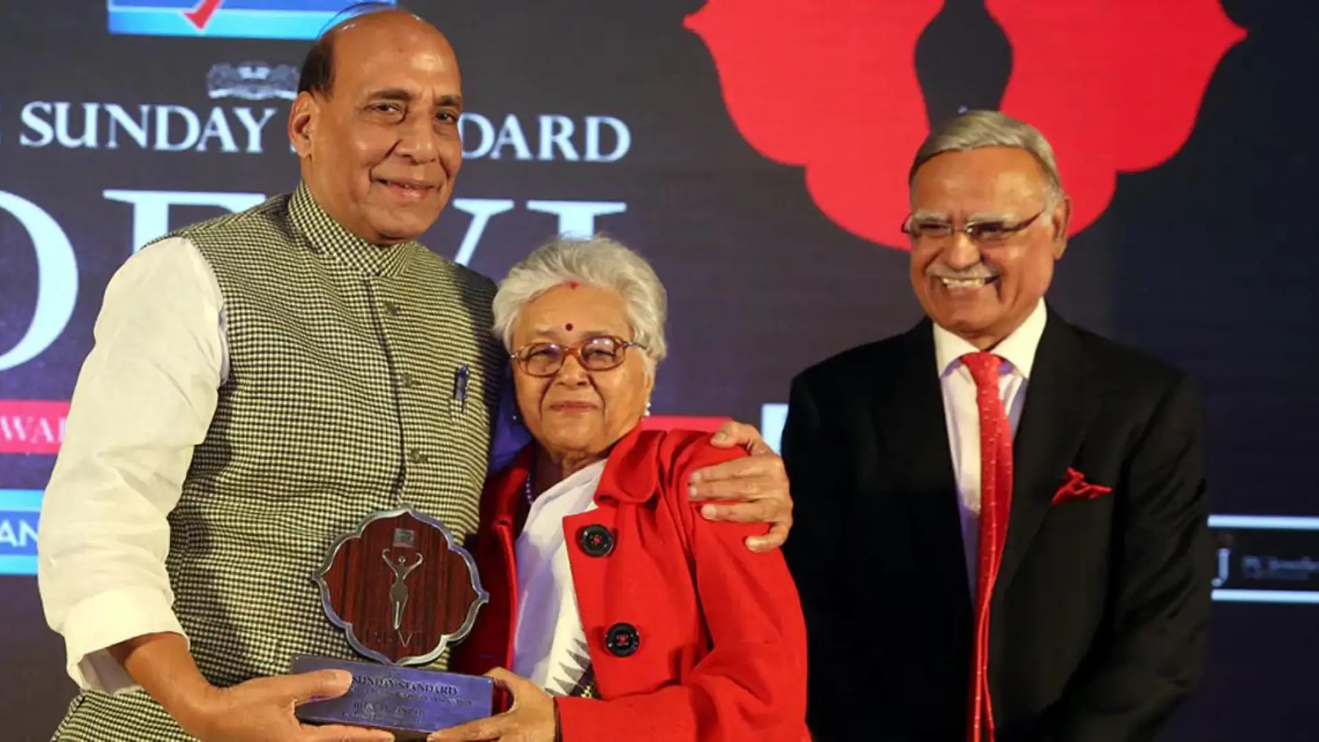 Mr Rajnath Singh presenting the Devi Award to Dr Gandhi