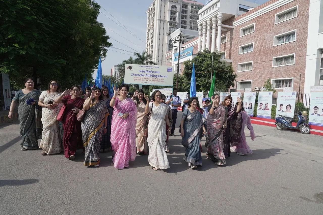 CMS leaders cheering on the meritorious students during the Character-Building March, ahead of the Meritorious Students' Felicitation Function 2026