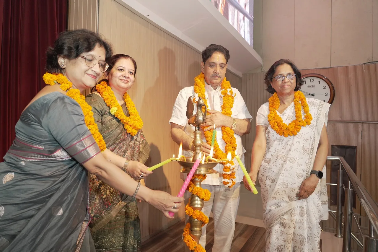 Chief Guest Shri Sunil Kumar Sharma Ji (Hon'ble Cabinet Minister for Electronics and Information Technology, Government of Uttar Pradesh), Prof. Geeta Gandhi Kingdon (Managing Director, CMS), Ms Reena Soti (Head – QAID, CMS), and Principal Mrs Abha Anant lighting the Lamp of Learning at the Meritorious Students' Felicitation Function 2026