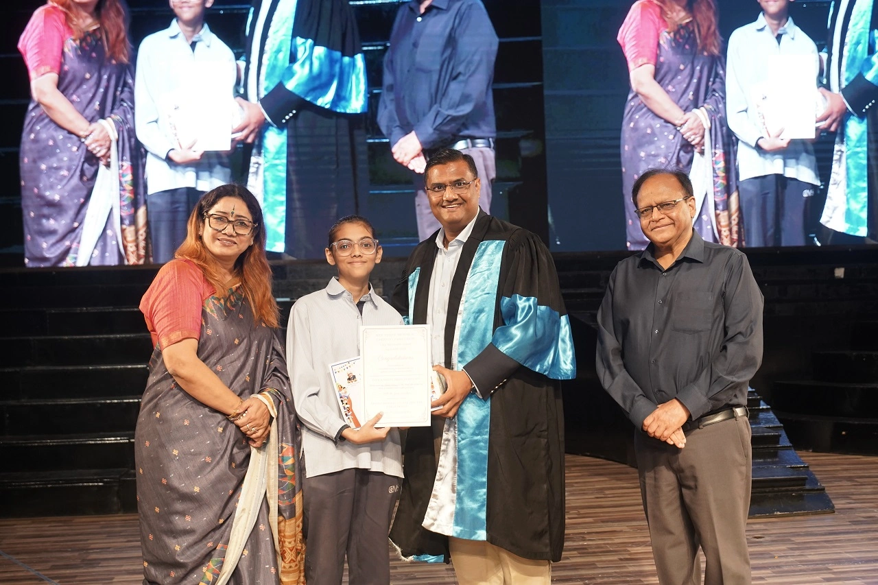 CMS Indira Nagar Campus I Student Naureen Kidwai receiving the second prize for the Ram Ugrah Memorial Cartoon Contest 2026 from ‘Guest of Honour’ Shri Prakash Gupta, IFS.